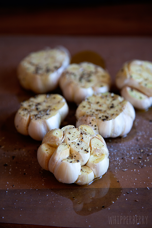 cut tops off of garlic and drizzle with olive oil with salt & pepper -- whipperberry