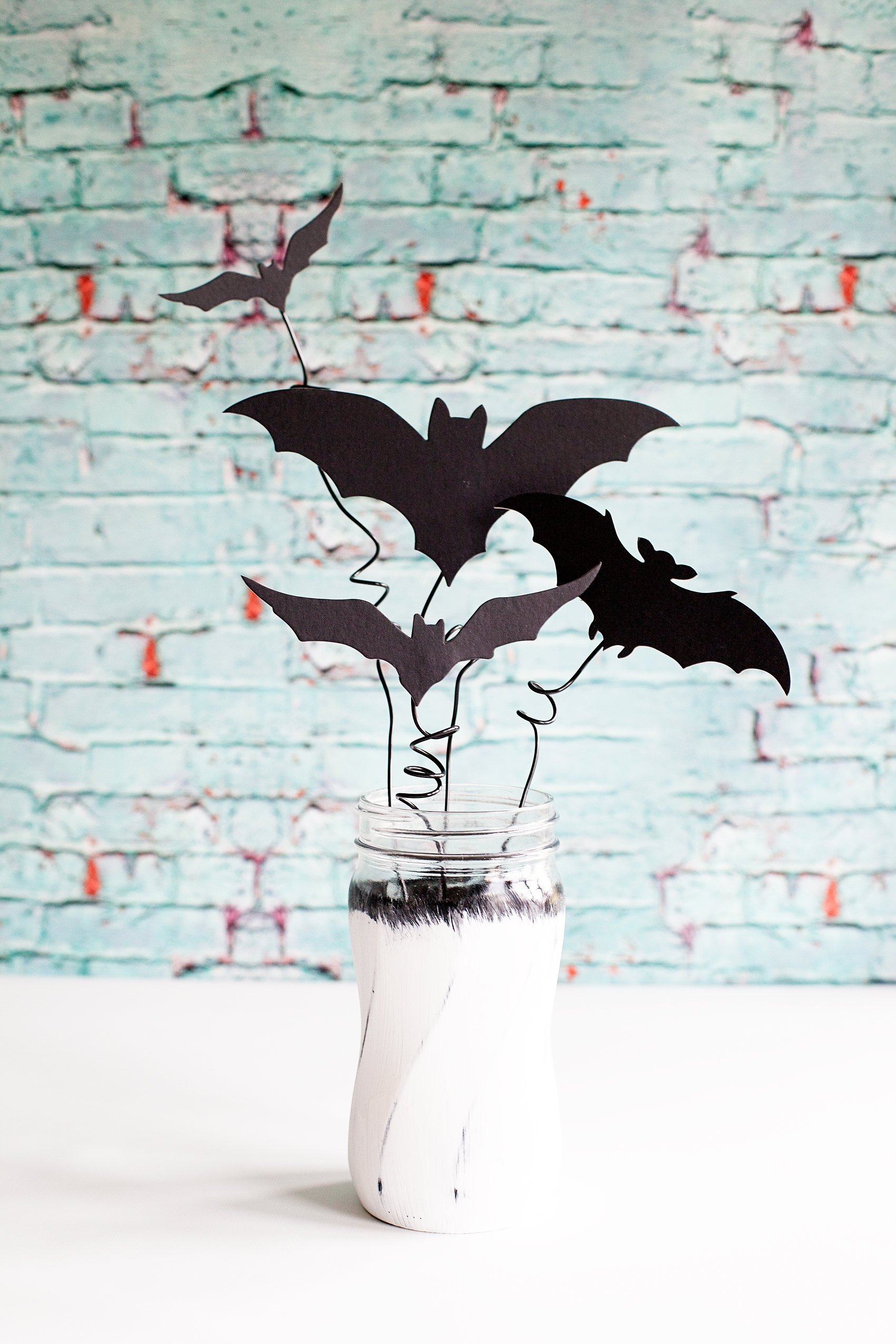 Chalky Finish Halloween Bat Jars • Have fun creating spooky Halloween decor with these Americana Decor Chalky Finish Ball Jars filled with creepy bats. Decorate your mantle or use them as a table centerpiece. Either way, they will add some stylish fun to your Halloween decoration game.