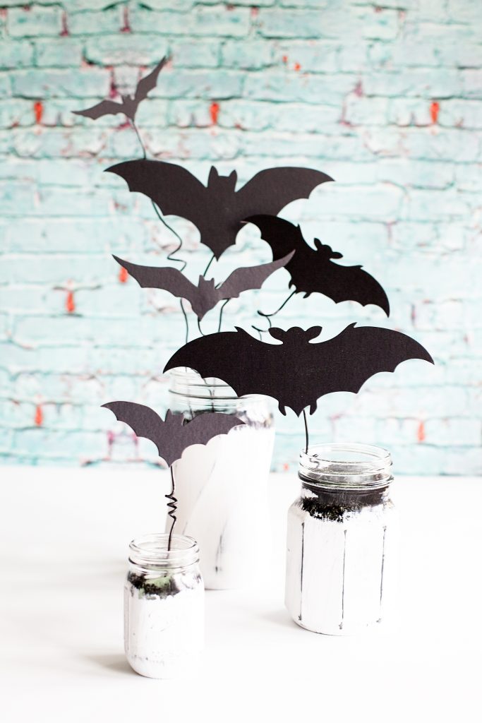 Chalky Finish Halloween Bat Jars • Have fun creating spooky Halloween decor with these Americana Decor Chalky Finish Ball Jars filled with creepy bats. Decorate your mantle or use them as a table centerpiece. Either way, they will add some stylish fun to your Halloween decoration game.