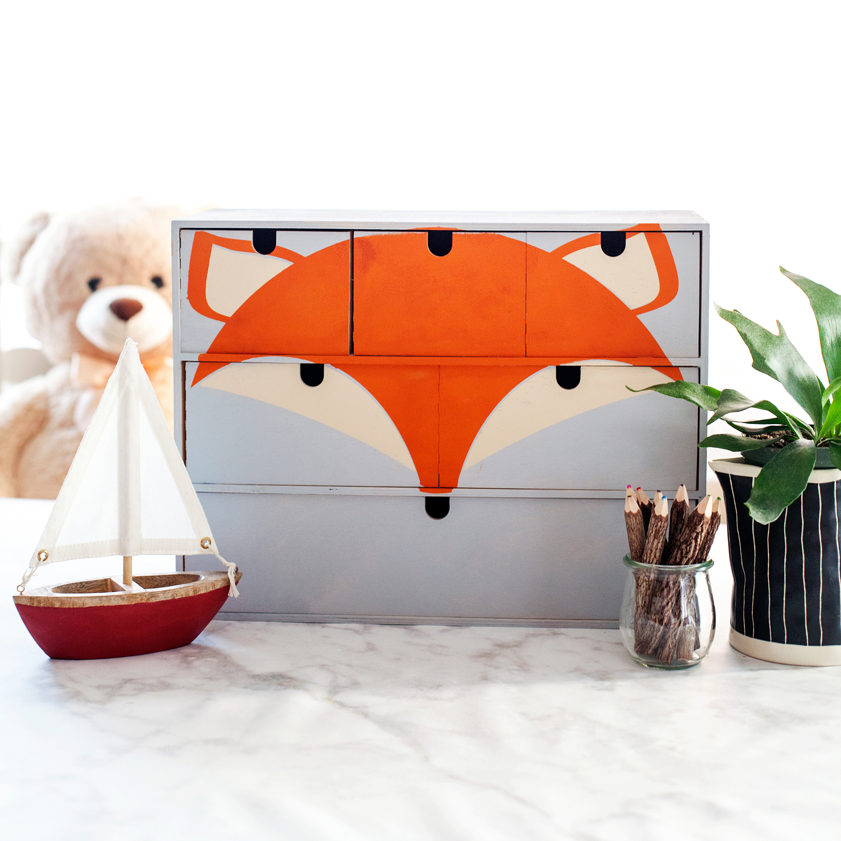 Transform a simple mini storage chest from IKEA into this cute little fox storage chest for your little ones little toys and trinkets. I used some of the @decoart chalky finish paint along with my @cricut Maker to create this fun design for my little boys room • WhipperBerry