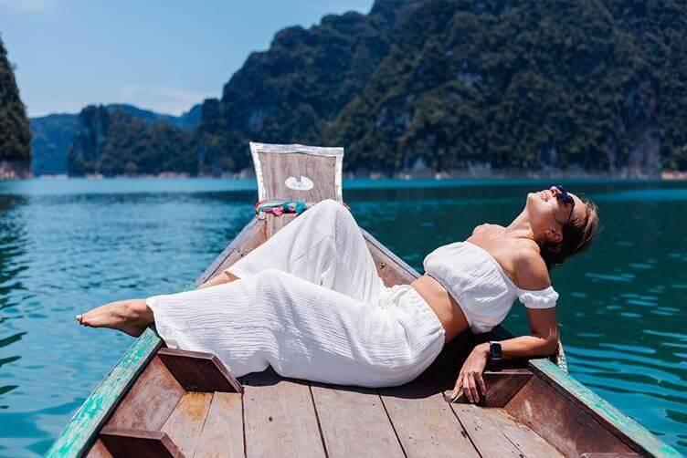 Woman relaxing on boat during island travel