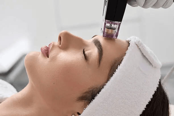 Woman receiving facial massage for anti-aging