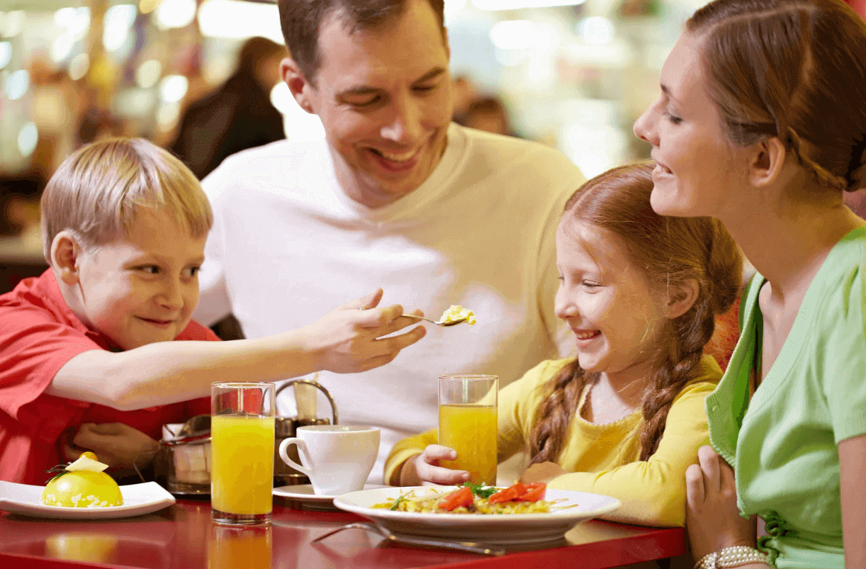Family enjoying meal at a budget-friendly fast food restaurant