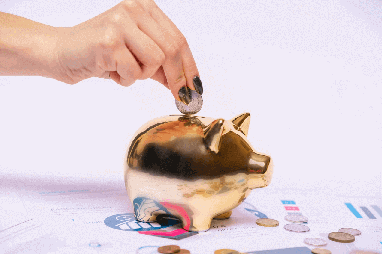Person saving money in a piggy bank
