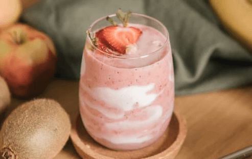 Strawberry smoothie garnished with fruit