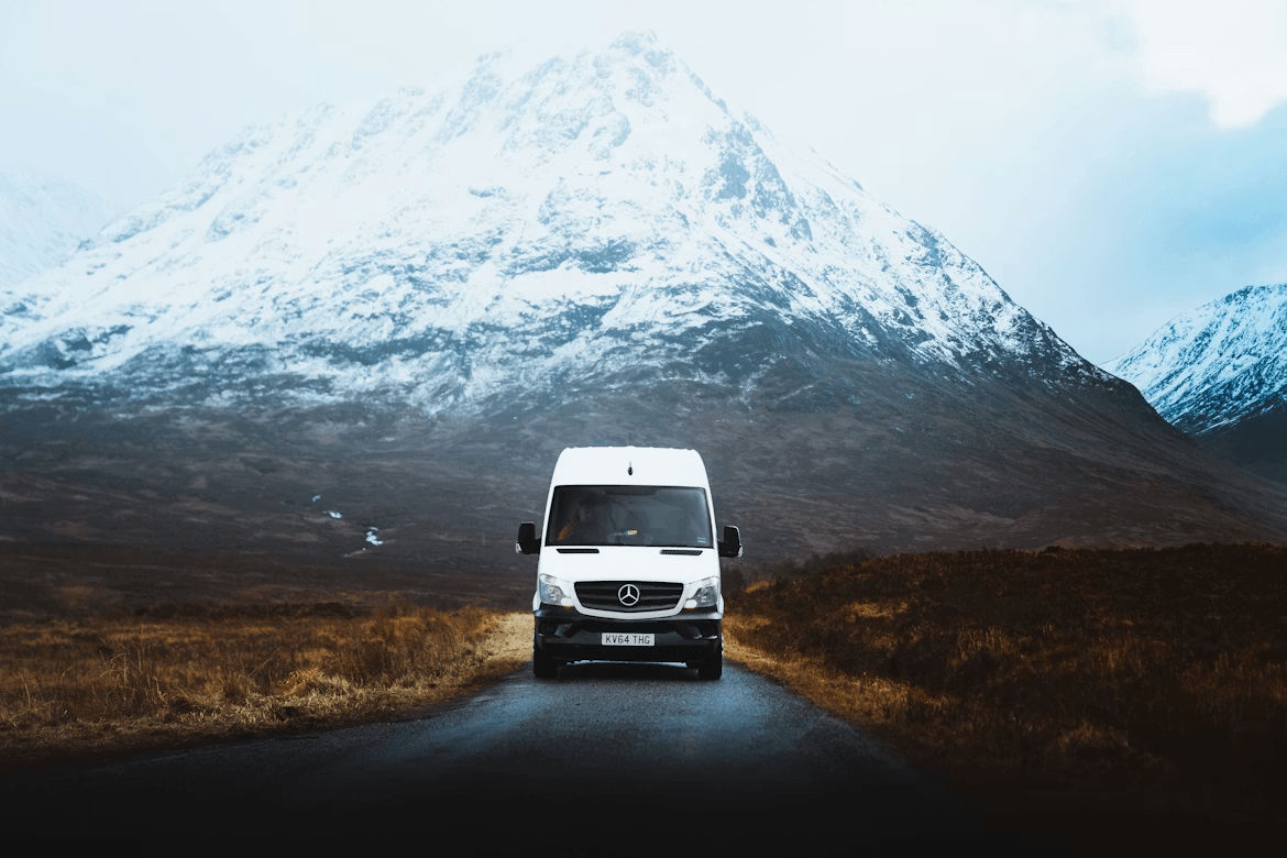 White van driving on an Icelandic road near