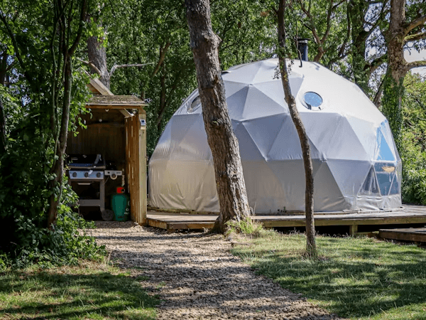 A yurt with a hot tub in the