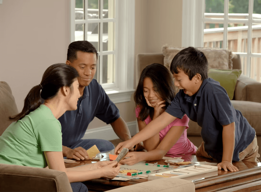 Family playing a board game together