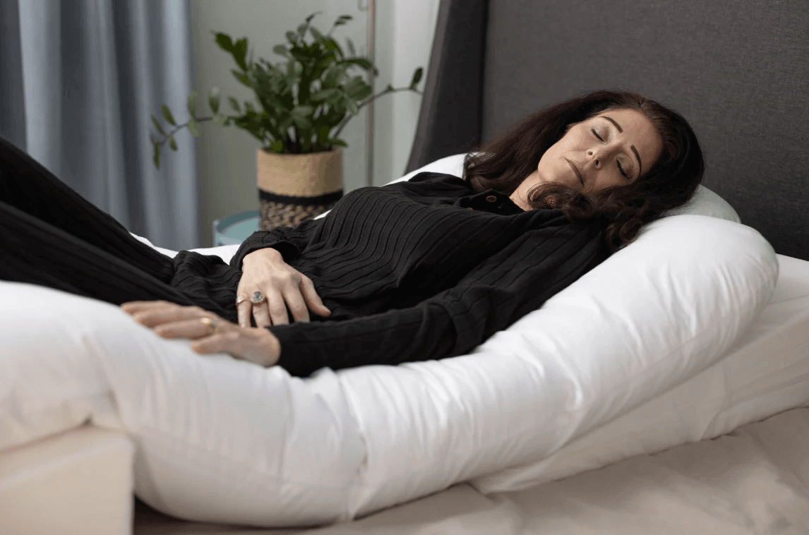 Woman resting in bed during BBL recovery