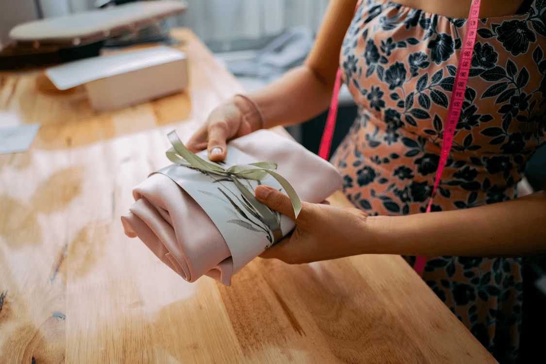 Woman wrapping a handmade gift