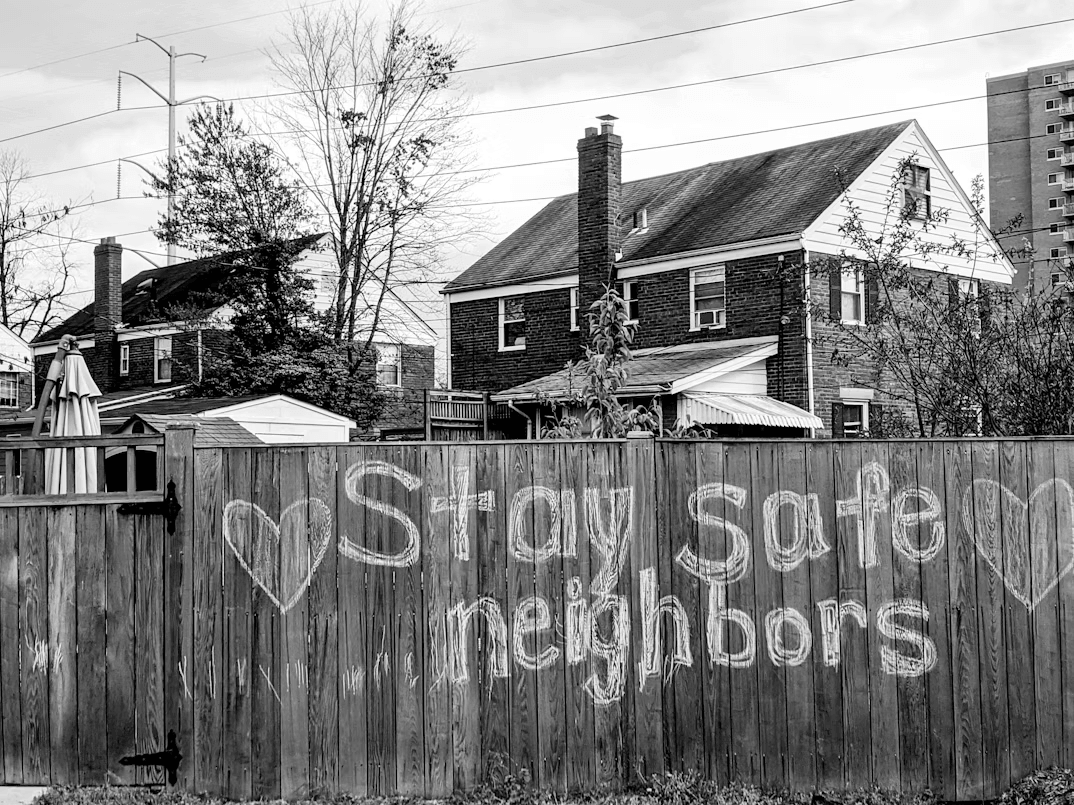 Wooden fence with graffiti representing rules and boundaries