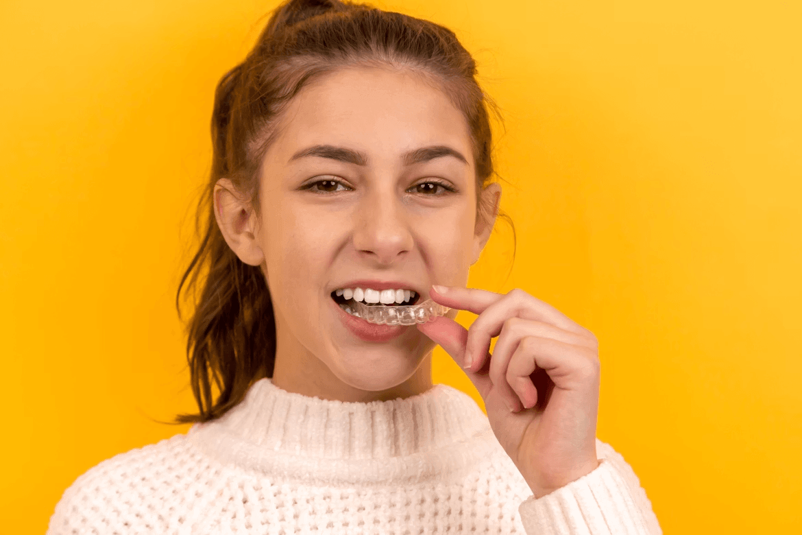 Young woman brushing teeth, demonstrating good oral hygiene