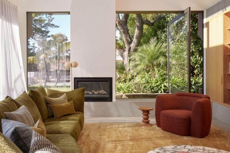 A beautifully furnished living room with a cozy fireplace