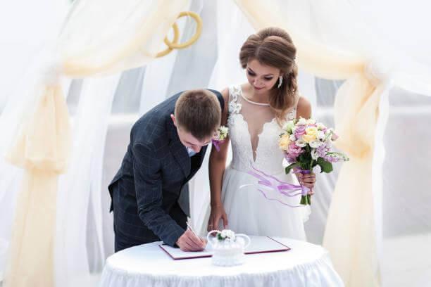 A bride and groom cutting their wedding