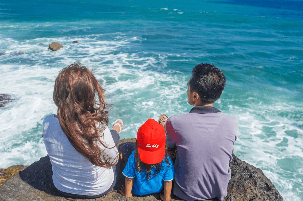 Family enjoying an adventurous ocean rock view