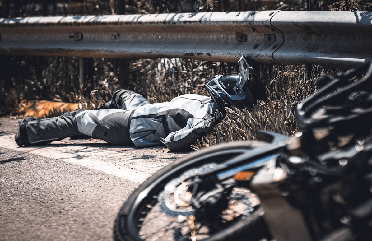 Person lying on the ground next to a
