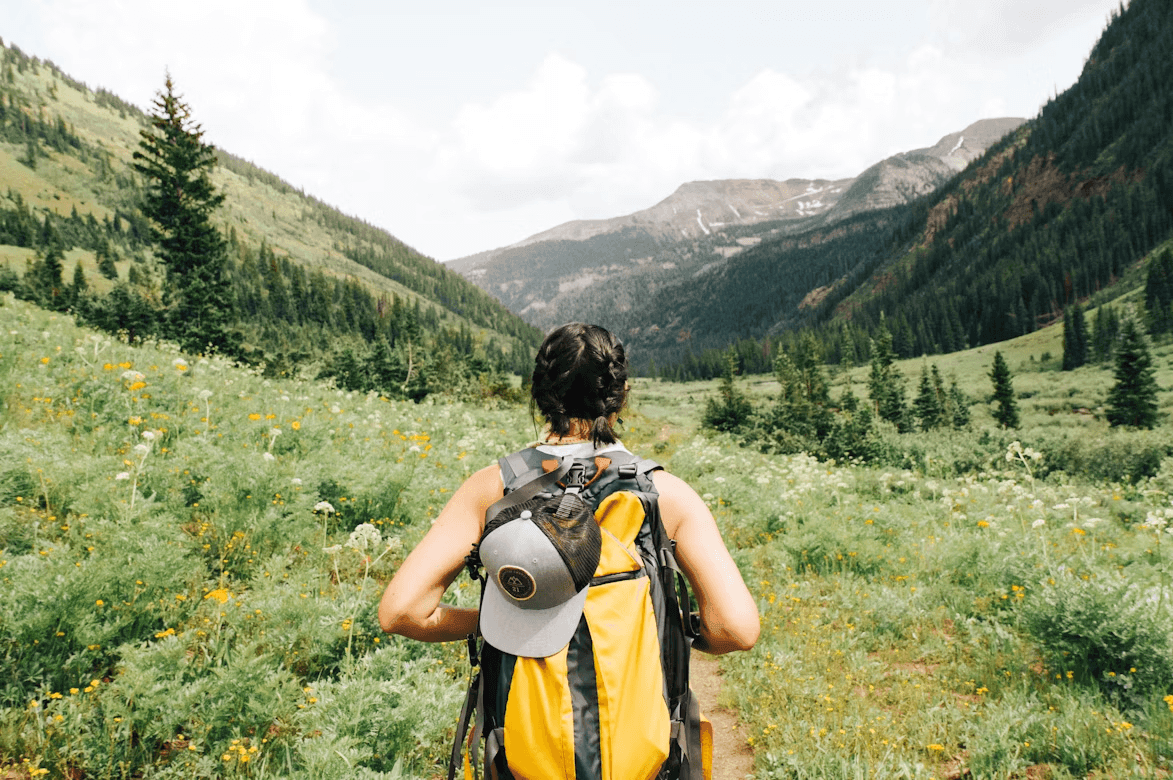 Solo traveler with a backpack walking through