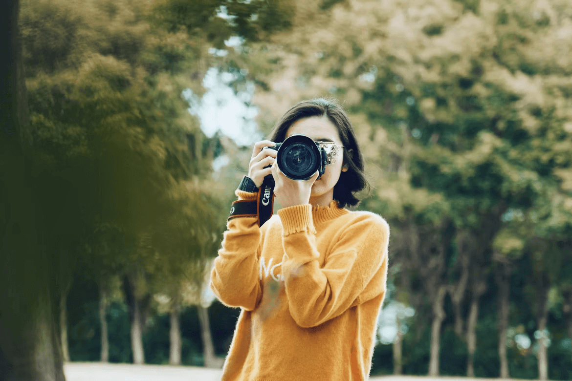 Woman taking a picture with a camera