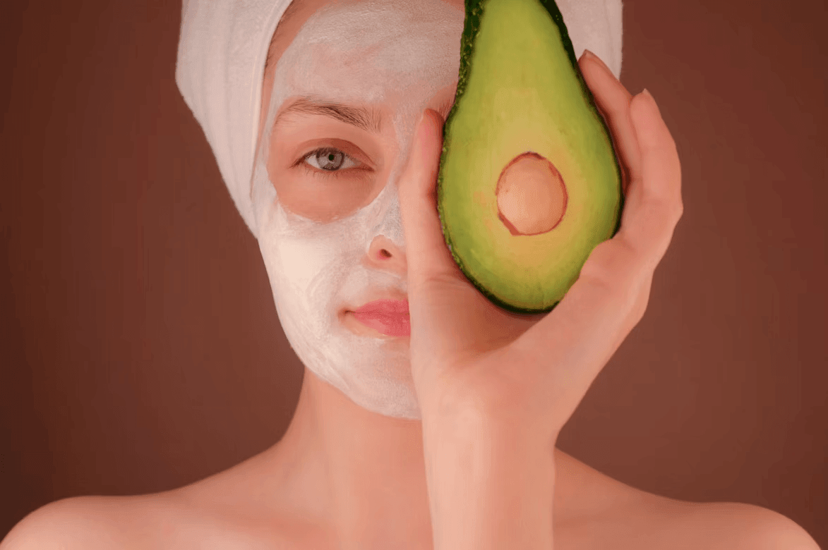 Woman with a towel on her head holding an