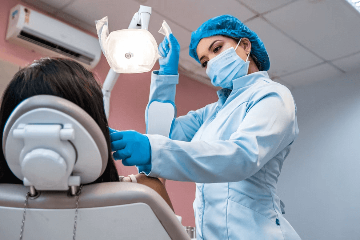 Dentist brushing a woman