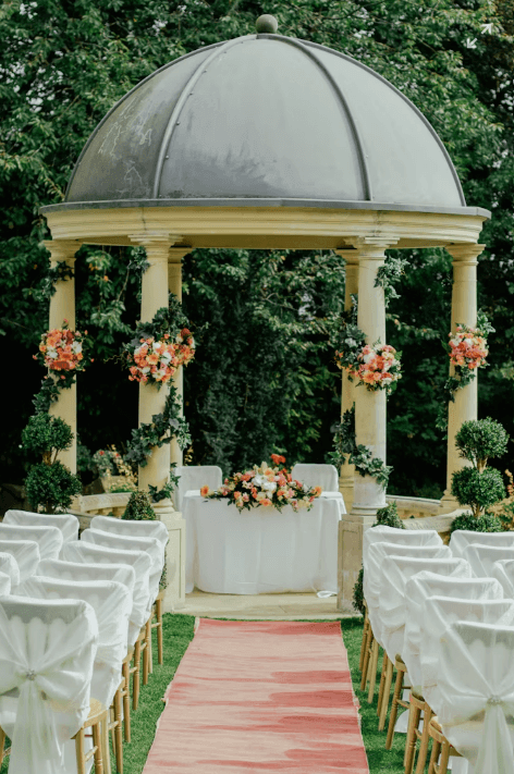 Elegant wedding ceremony setup with white linens and