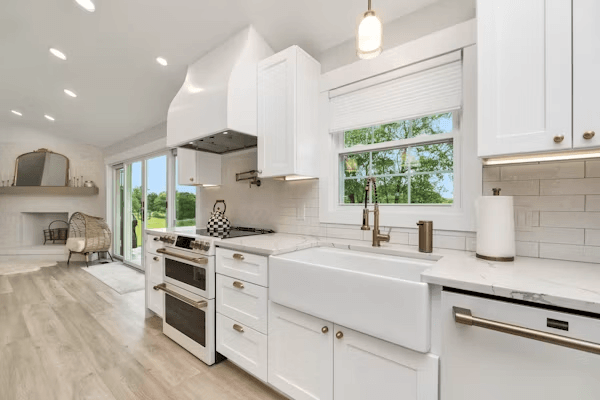 Kitchen with white cabinets and wood floors