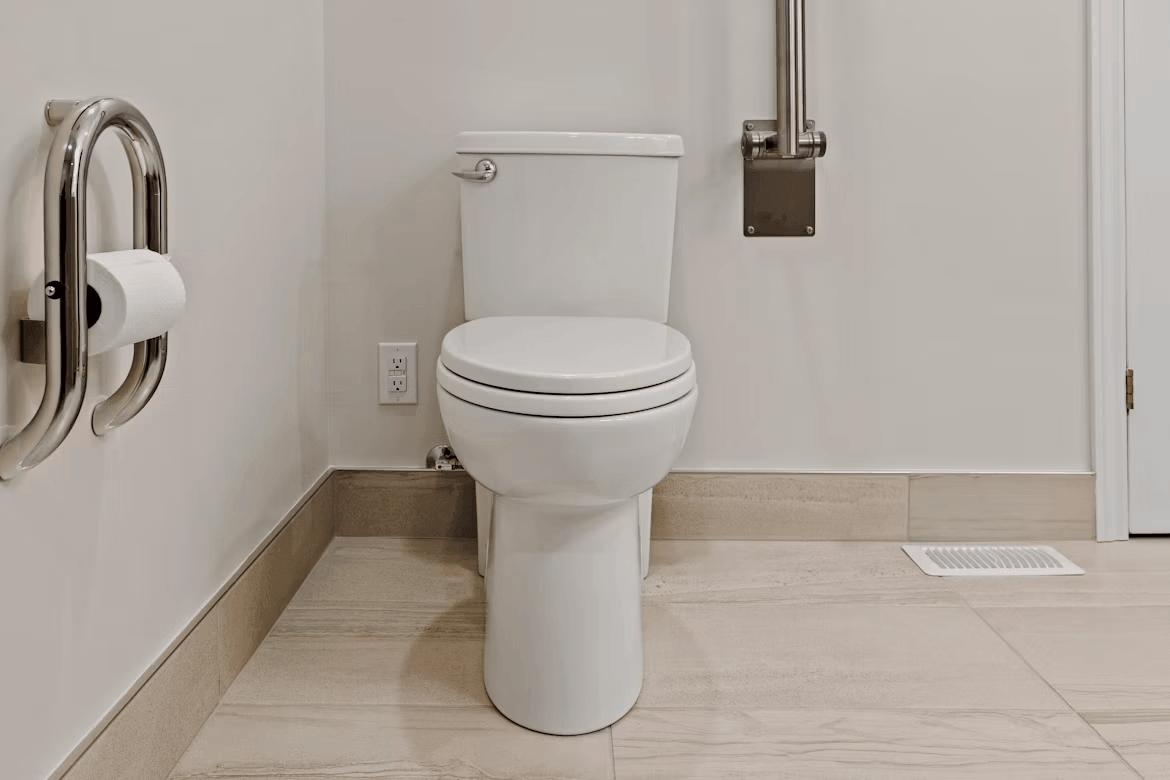 White toilet in a bathroom, ready for