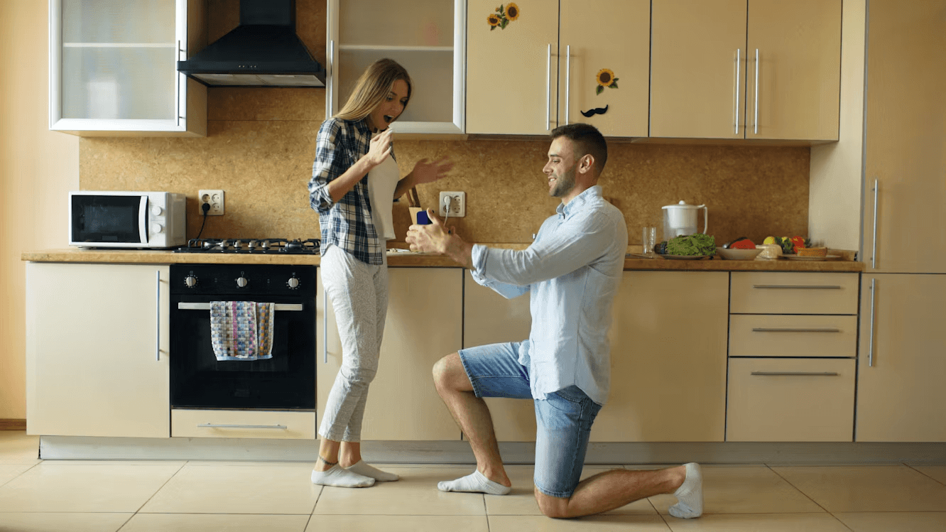 Man proposing to woman in kitchen
