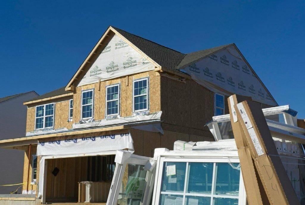 New house under construction with front windows