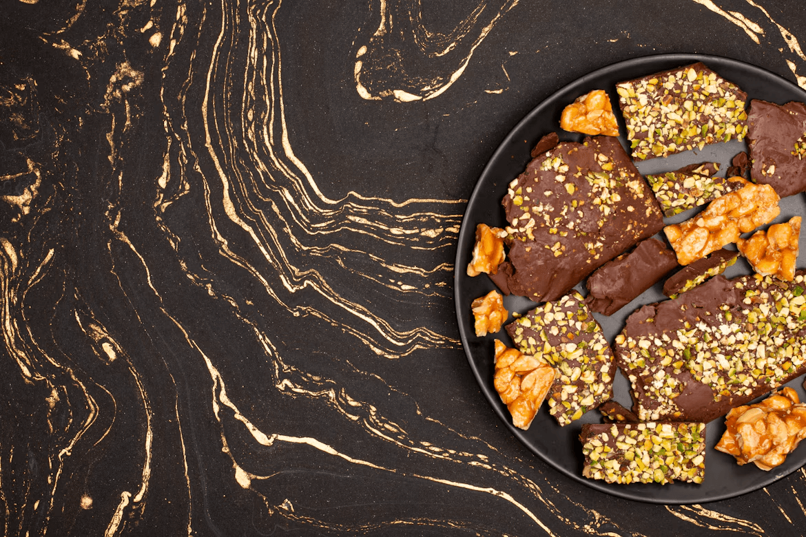 Plate of food on a black table